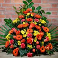 Gesteck | in gelb – orange — Blumen Kleissner Graz