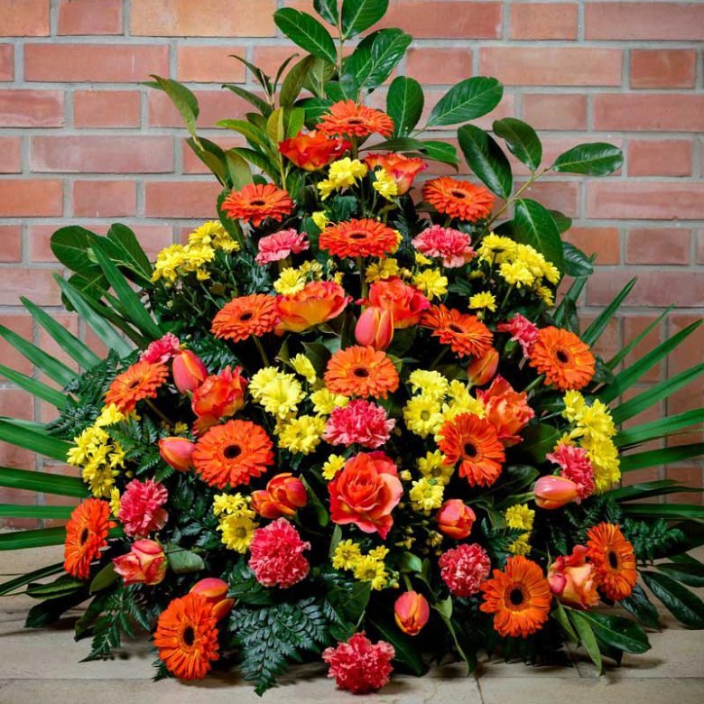 Gesteck | in gelb – orange — Blumen Kleissner Graz
